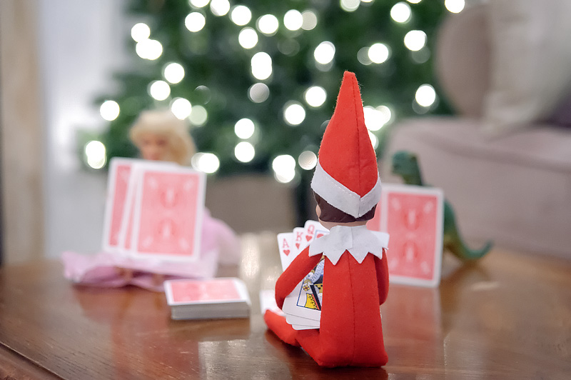 elf on the shelf playing cards with barbie, Newmarket Family Photography by Sugarlens Photography